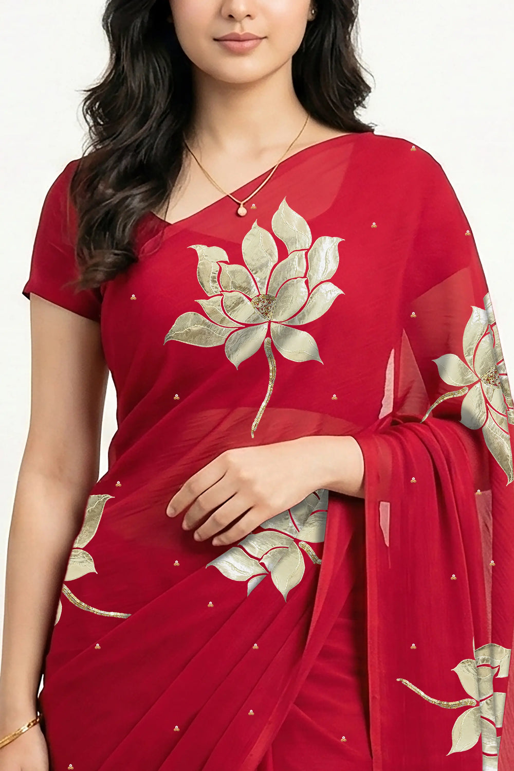 An Indian woman in Red Padma Saree embellished with Blooming lotus flowers made of Gota, Zari & sequins by craft of Aari-Zardosi, a product of Umaid Couture