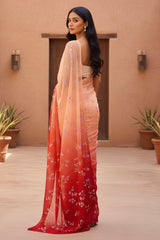 Woman wearing a saree with a gradient design in an outdoor setting. Product by Umaid Couture.