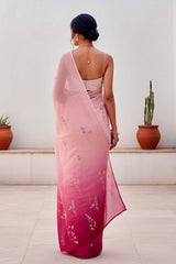 Woman wearing a pink and magenta sequins embroidered saree by Umaid Couture with a white background