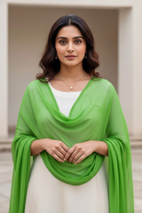 Woman wearing a green scarf over a white top in an outdoor setting. Product by Umaid Couture