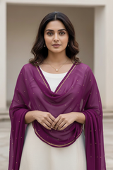 Woman wearing a purple dupatta over a white outfit with a neutral background. Product by Umaid Couture.