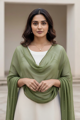 Woman wearing a green dupatta over a white outfit with a neutral background. product by Umaid Couture