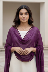 Woman wearing a purple scarf over a white outfit with a neutral background. product by Umaid Couture