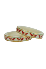 Two ceramic bracelets with red floral patterns on a white background