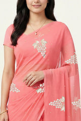 An Indian Woman in rose coral pink saree embellished with grape Motifs made of Gota, Zari and Sequins by Umaid Couture