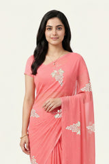 An Indian Woman in rose coral pink saree embellished with grape Motifs made of Gota, Zari and Sequins by Umaid Couture