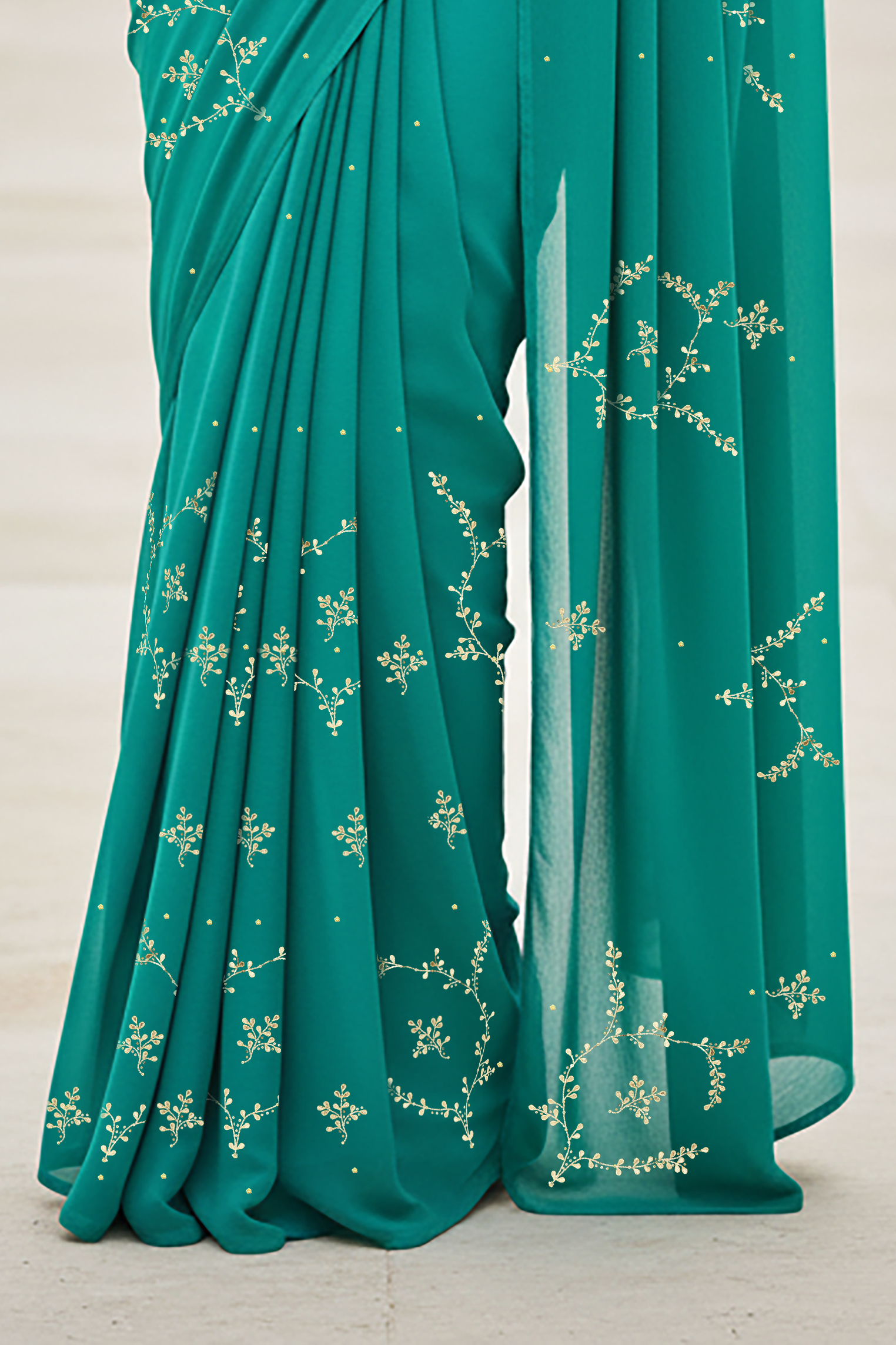 Teal saree with floral patterns on a light background