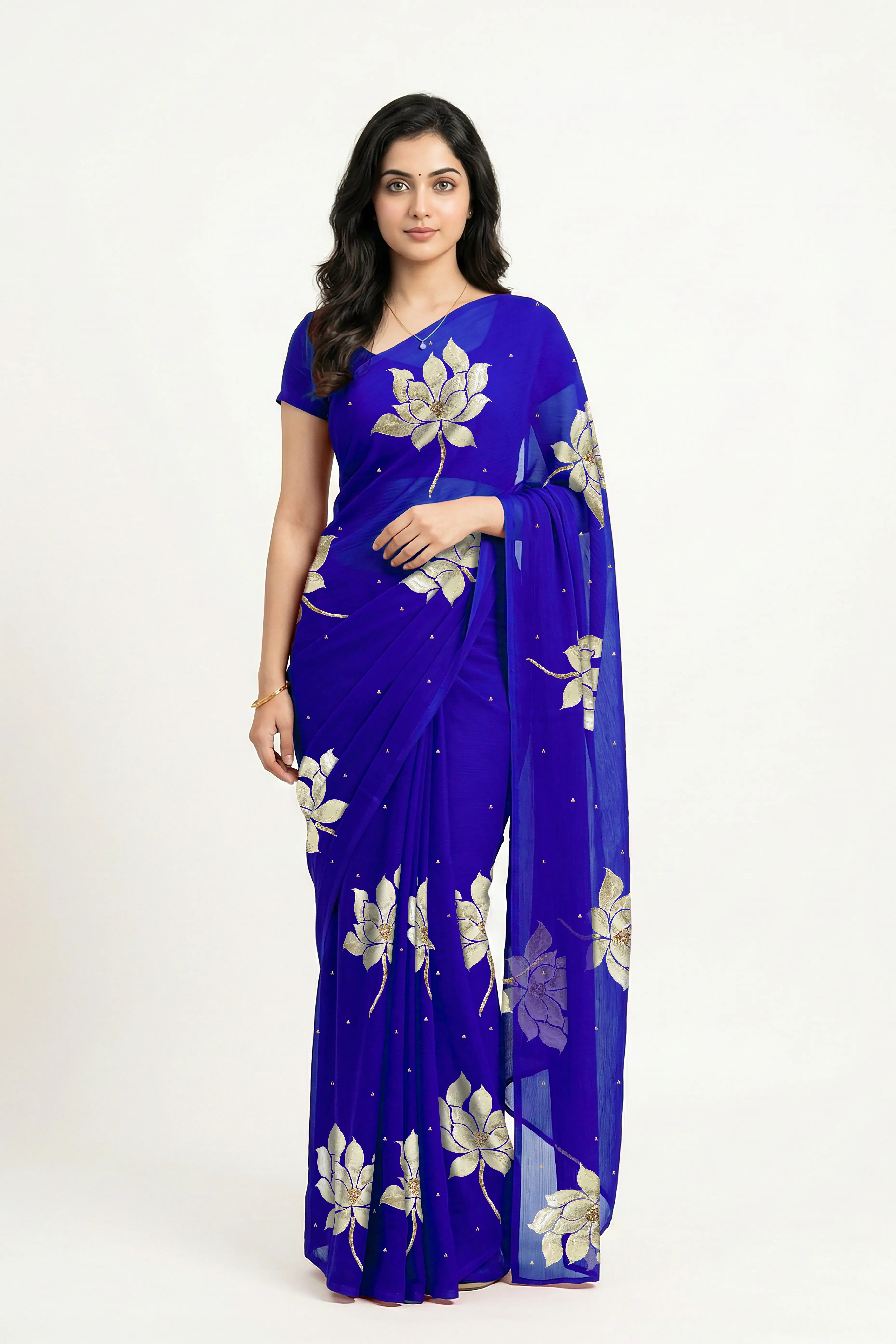An Indian woman in blue Padma Saree embellished  with Blooming lotus flowers made of Gota, Zari & sequins by craft of Aari-Zardosi, a product of Umaid Couture