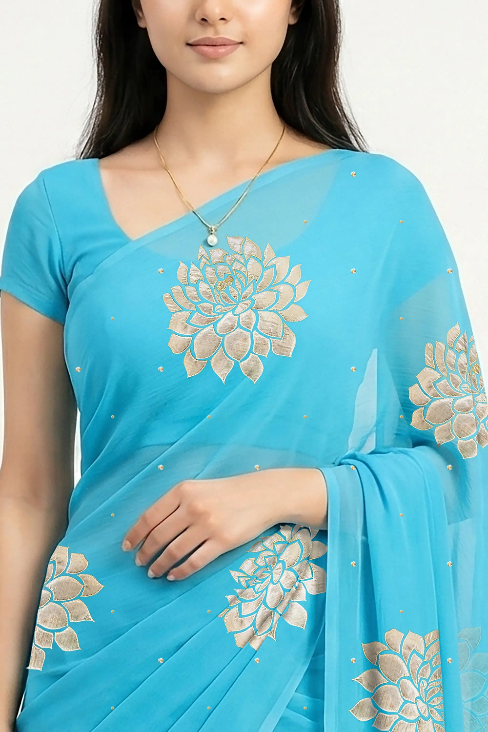 An Indian woman in Middle Blue Dahlia Saree embellished with Blooming Dahlia flowers made of Gota, Zari & sequins by craft of Aari-Zardosi, a product of Umaid Couture