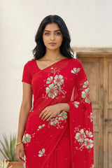 Model wearing a red Kusum Mulberry Silk  Chiffon saree embellished with Gota-Sequins Motifs by Umaid Couture