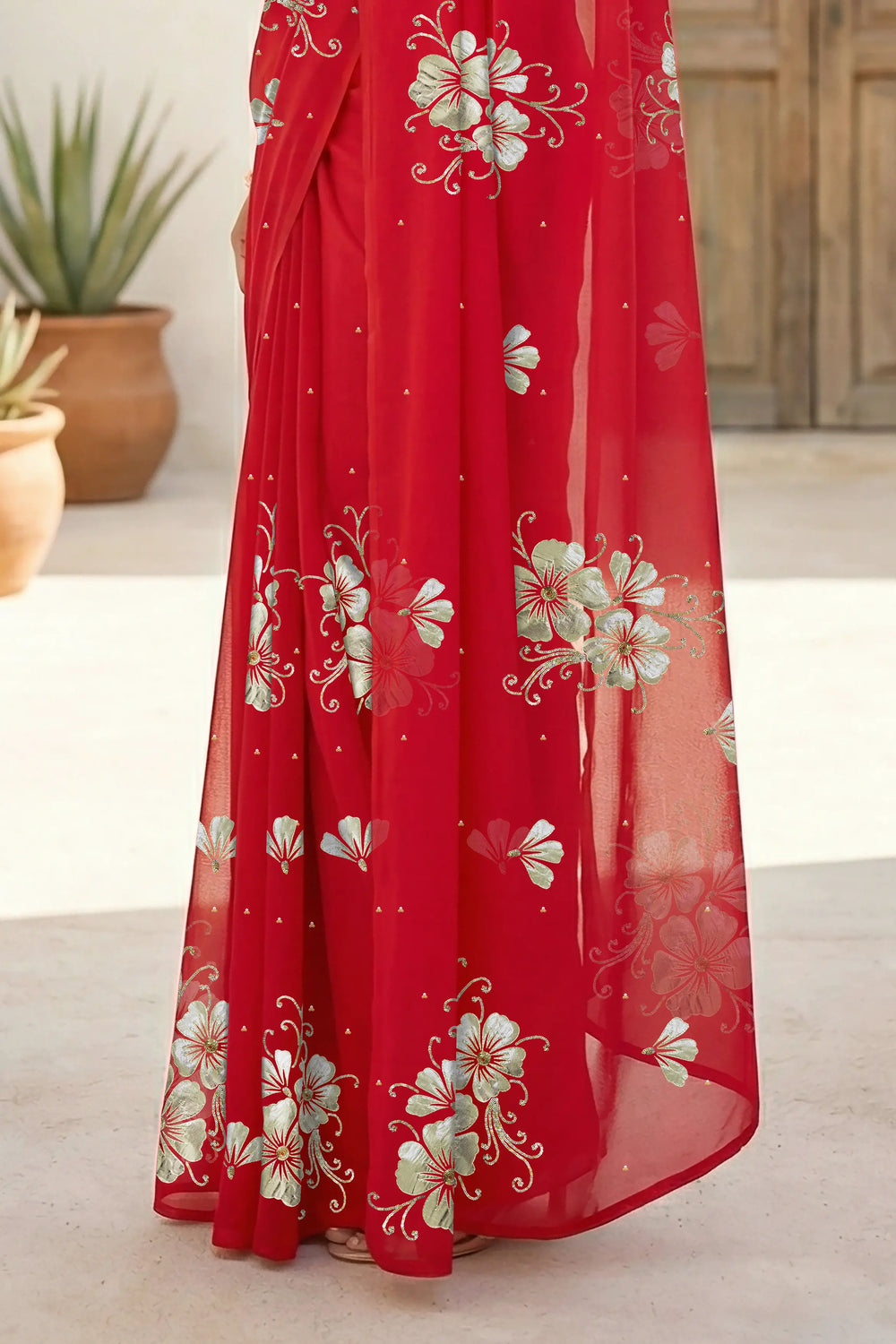 Model wearing a red Kusum Mulberry Silk  Chiffon saree embellished with Gota-Sequins Motifs by Umaid Couture