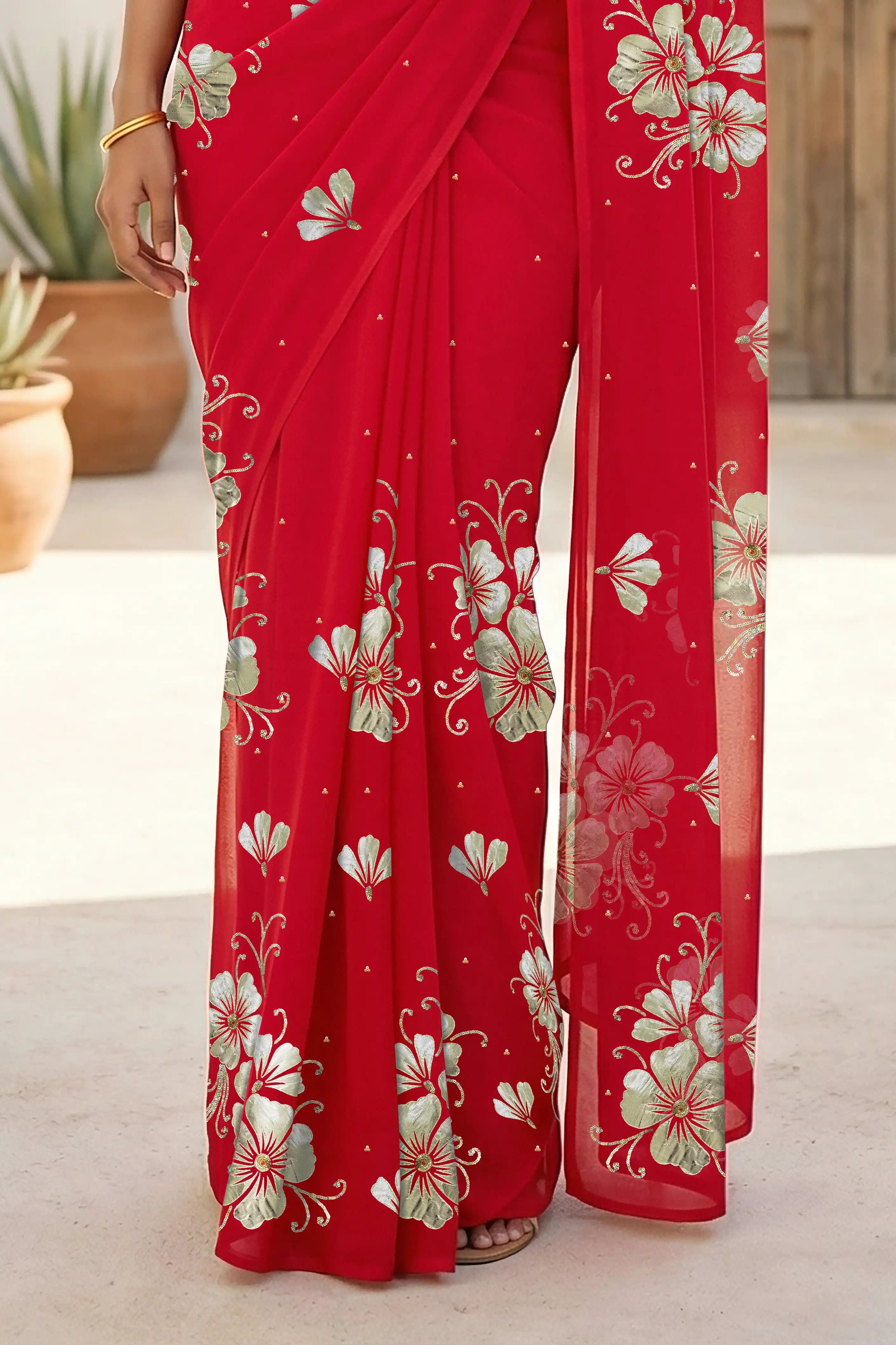 Model wearing a red Kusum Mulberry Silk  Chiffon saree embellished with Gota-Sequins Motifs by Umaid Couture