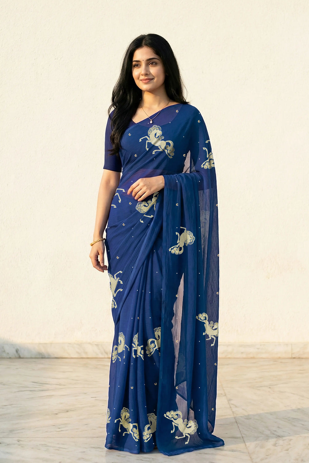 woman in Blue saree with silver golden sequins unicorn motif designs saree and finely work done with aari-zardosi  made by umaid couture.
