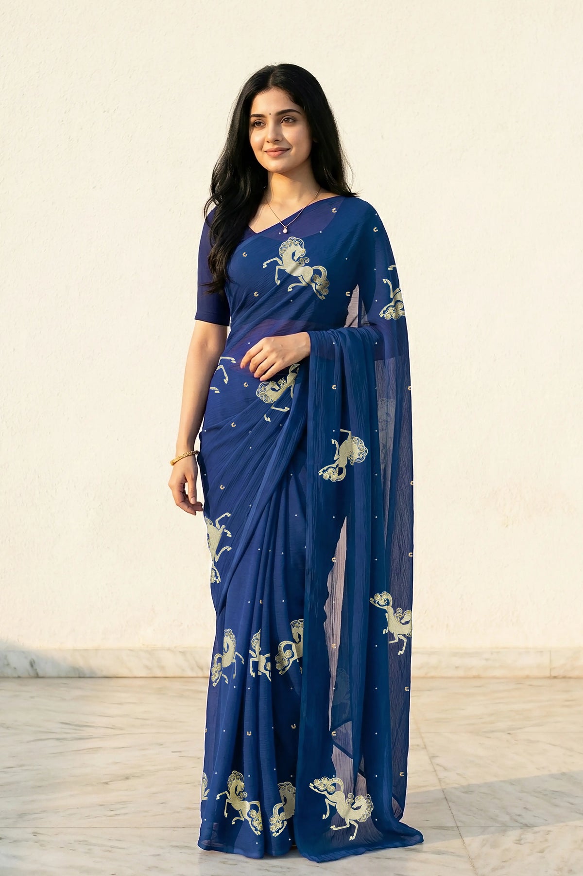 woman in Blue saree with silver golden sequins unicorn motif designs saree and finely work done with aari-zardosi  made by umaid couture.
