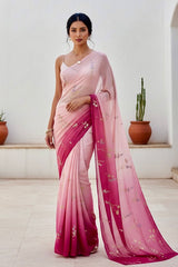 Woman wearing a pink and magenta sequins embroidered saree by Umaid Couture with a white background 