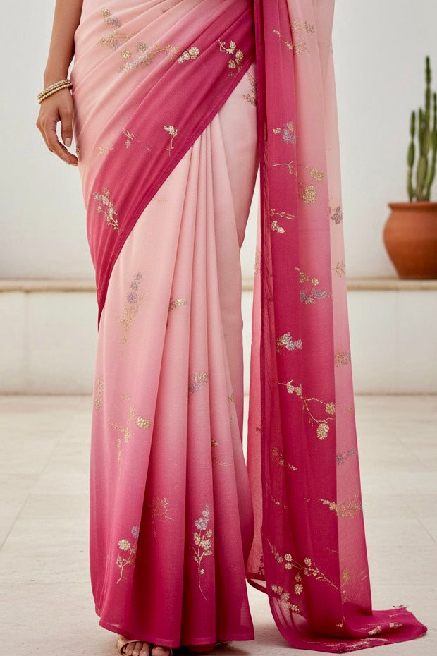 Woman wearing a pink and magenta sequins embroidered saree by Umaid Couture with a white background 