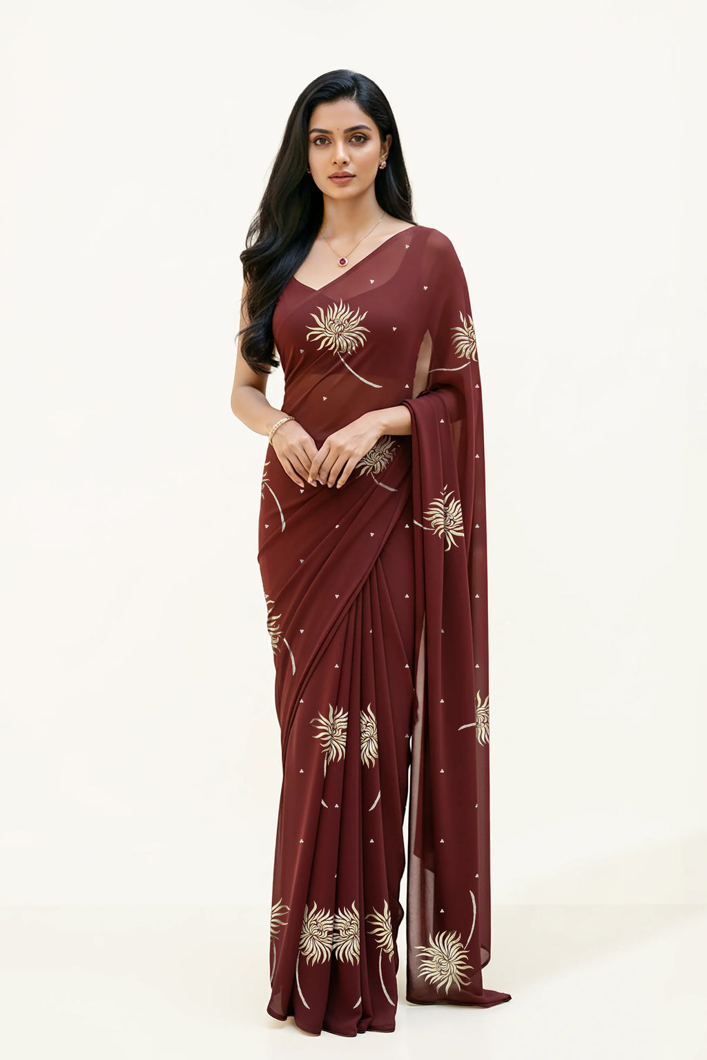 An Indian Woman in dark chocolate color saree embellished with Shevanti flower Motifs made of Gota, Zari and Sequins by Umaid Couture