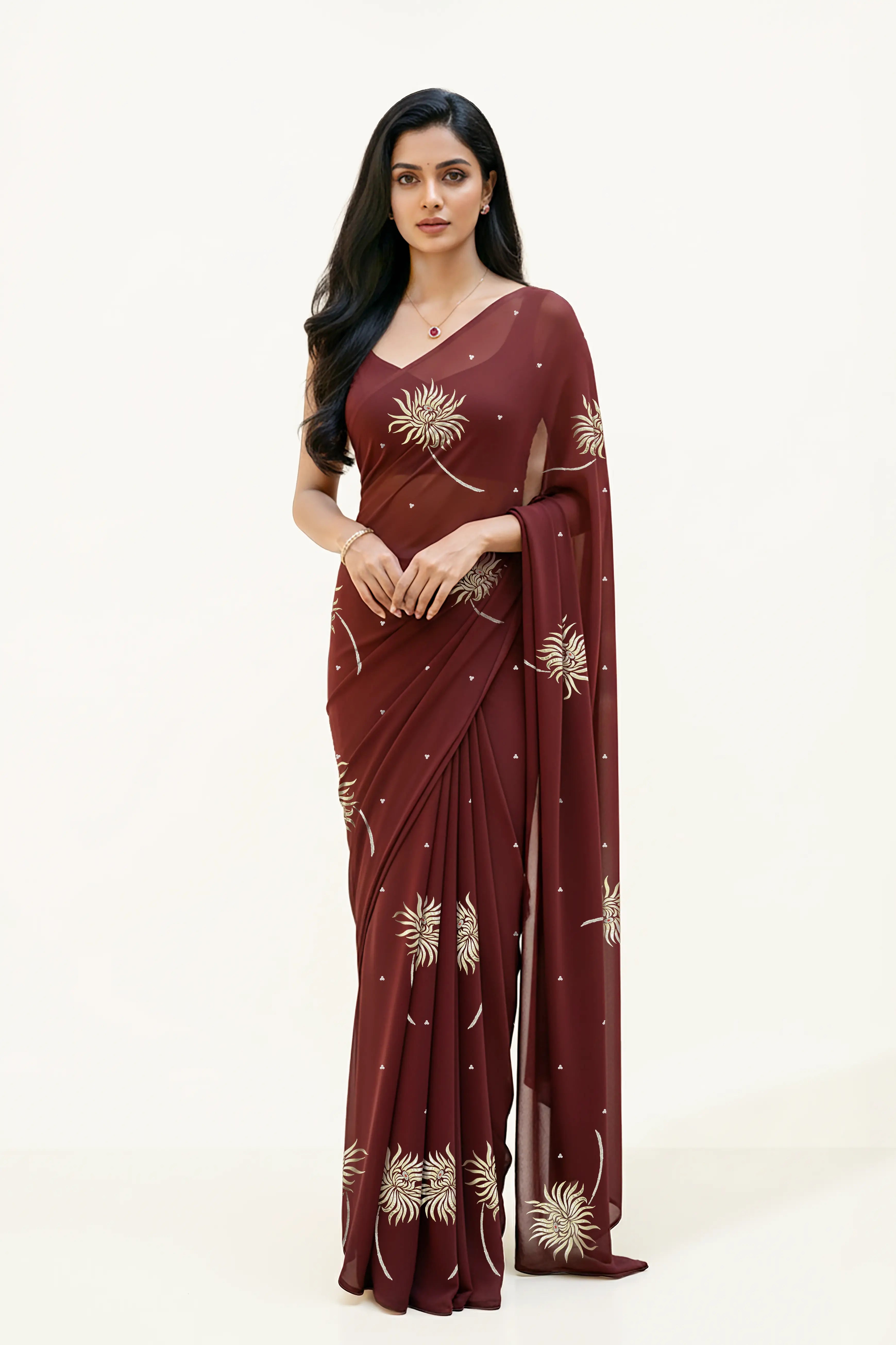 An Indian Woman in dark chocolate color saree embellished with Shevanti flower Motifs made of Gota, Zari and Sequins by Umaid Couture