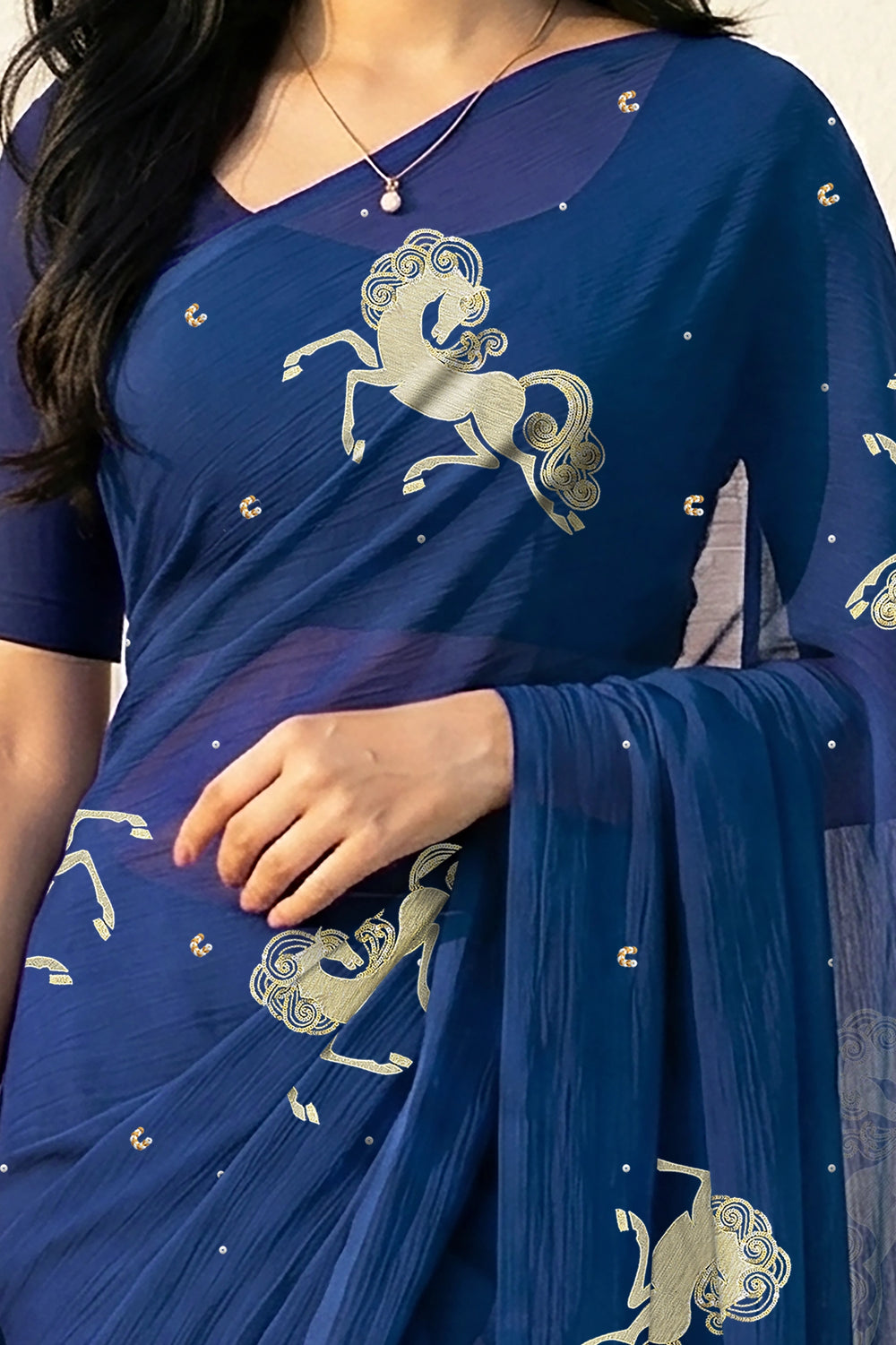 woman in Blue saree with silver golden sequins unicorn motif designs saree and finely work done with aari-zardosi  made by umaid couture.
