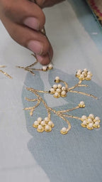 Video of artisan making Pearl Whispers Saree by Umaid Couture in shade of Blue 