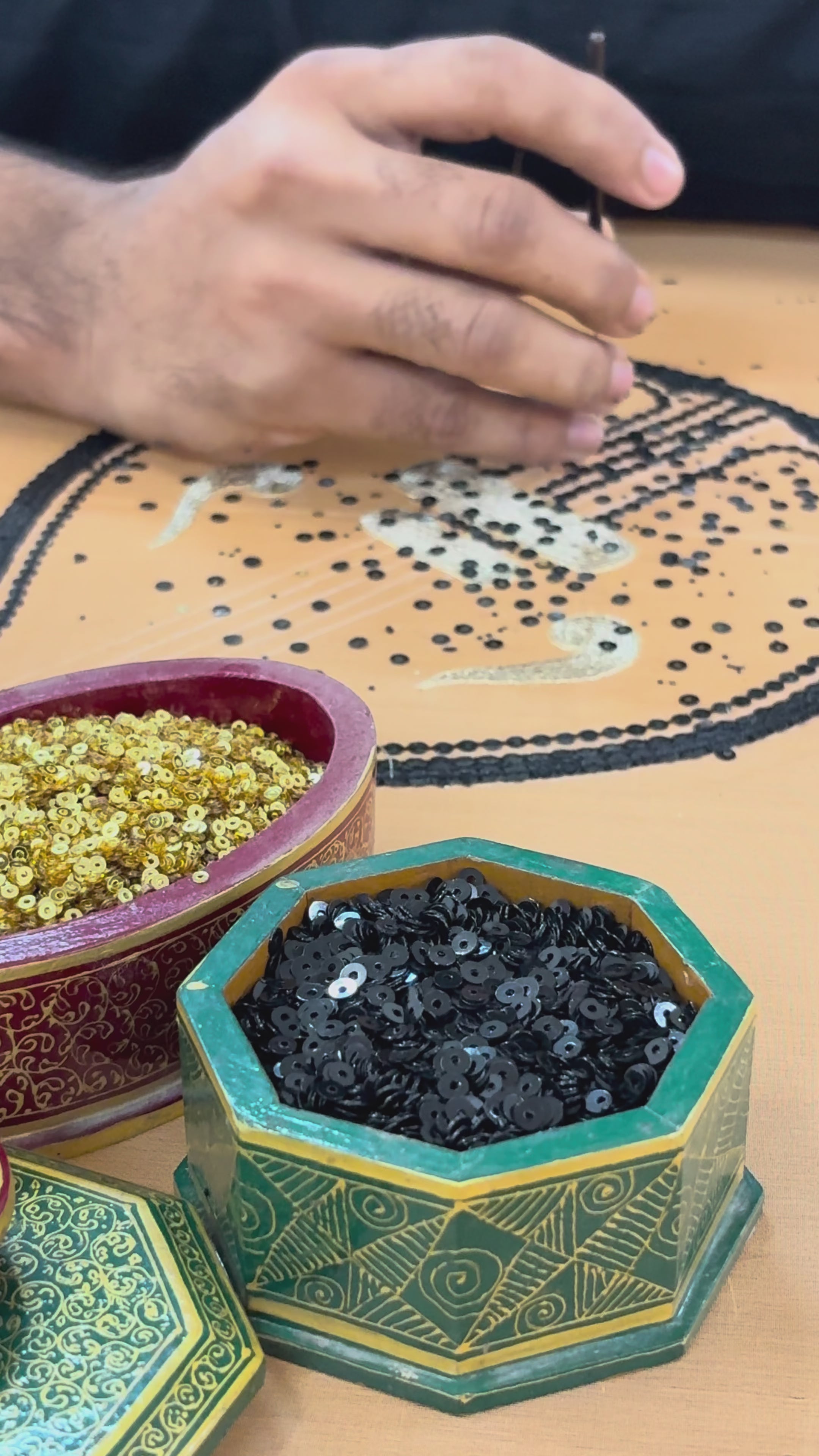 A video of making of Ragini the Sitar Motif peach saree by Umaid Couture