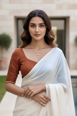 Woman wearing a traditional saree with a blurred background. product by Umaid Couture